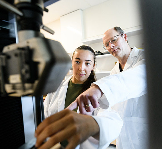 Raven Haines and Mechanical Engineering's Gary Weber work in the Materials Lab.