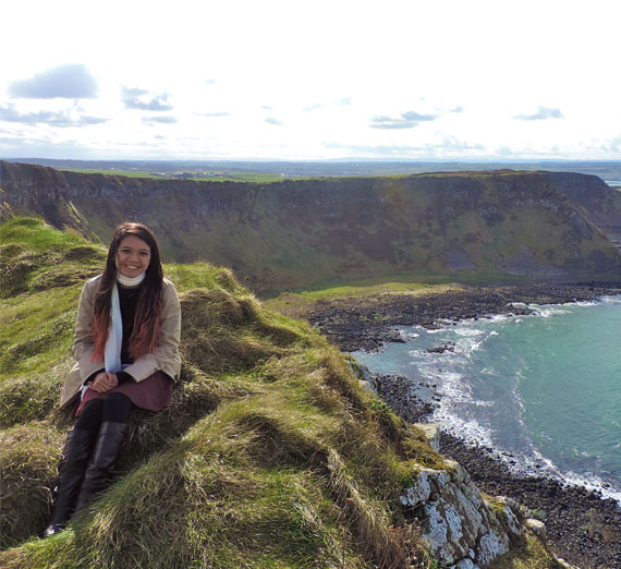 student on cliffs by the sea