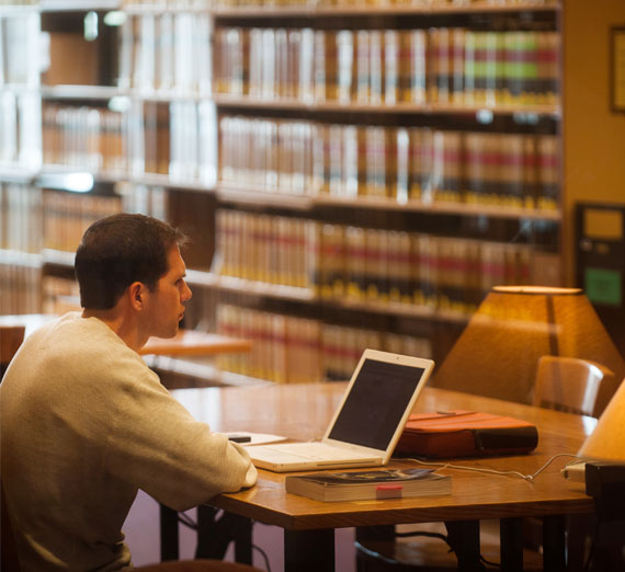 A student studying in the Foley Library 