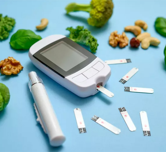 A photo of a diabetes testing kit and healthy snacks.