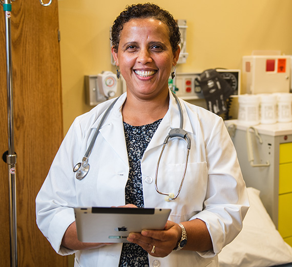 DNP graduate holding clipboard 