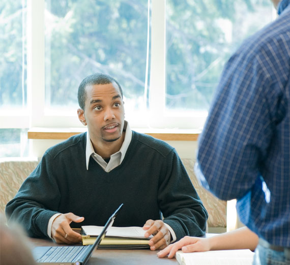 A student taking notes in class