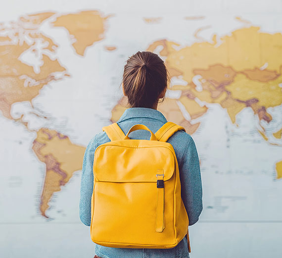 Student looking at map of the world