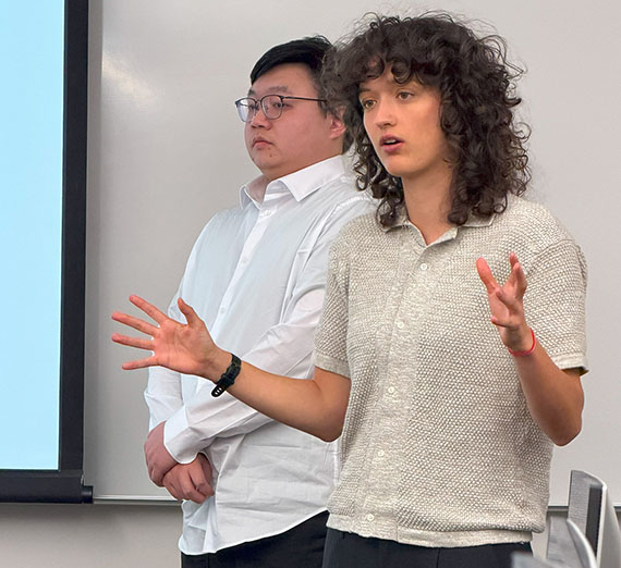 Computer Science student gestures while presenting