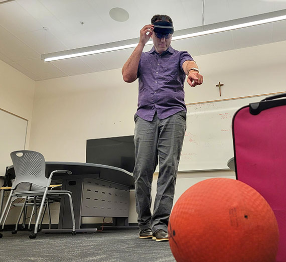 Crandall with VR glasses