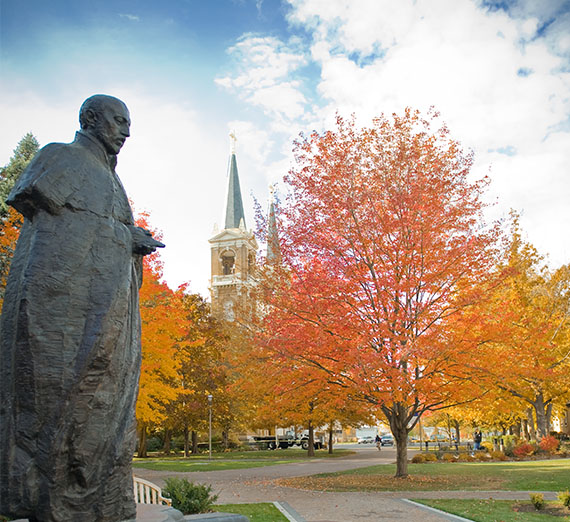 Statue of St. Ignatius with St. Al's in the background