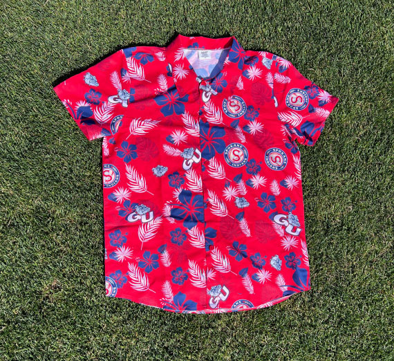 photo of a short-sleeve button down shirt with Gonzaga Athletics logo and Spokane Indians baseball team logo.