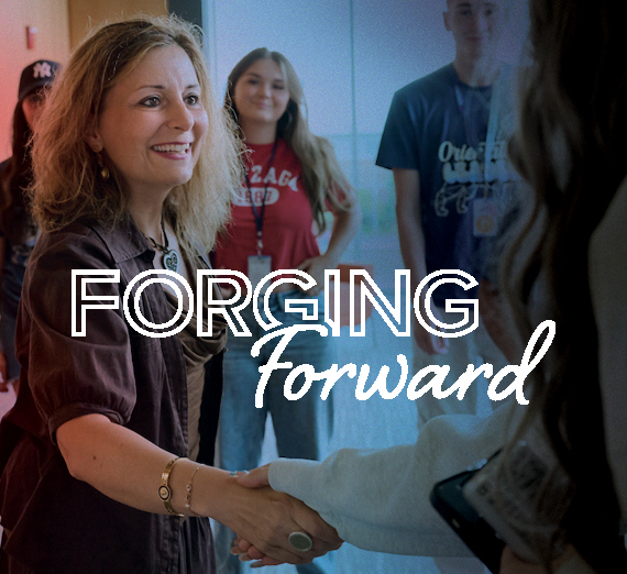 Meet the President: Katia Passerini, Ph.D. "Open Doors. Empower Potential. Lead With Hope" Gonzaga President, Katia Passerini, Ph.D., stands in front of College Hall.