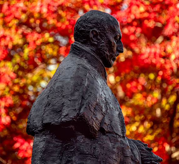 St. Ignatius statue located on Gonzaga University campus in autumn time