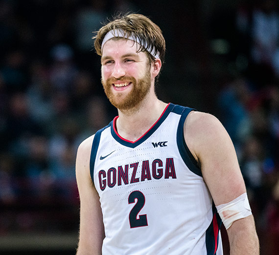 Gonzaga men's basketball player Drew Timme smiles during a game.
