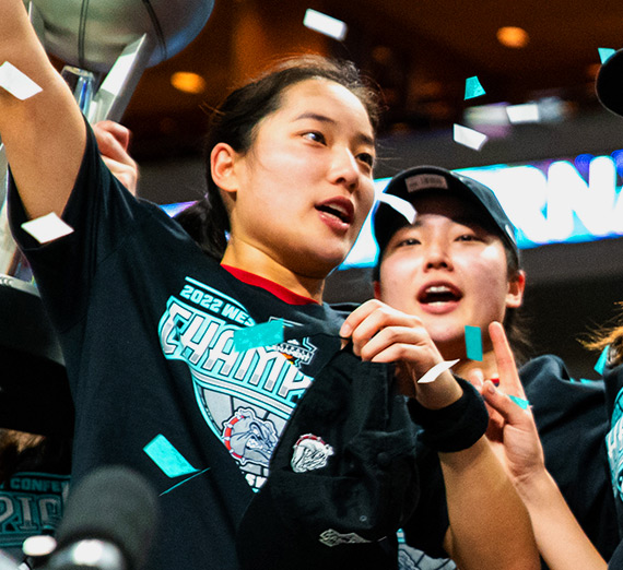 Gonzaga women's basketball players Kayleigh and Kaylynne Truong celebrate winning the WCC tournament championship in 2022.