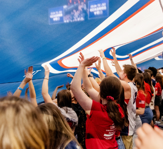 Zags hold up a GU flag in the Kennel