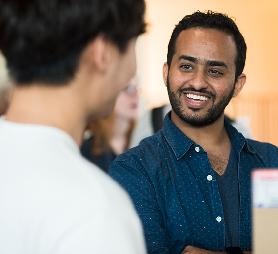 A leadership representative talks with a 51�Թ�.