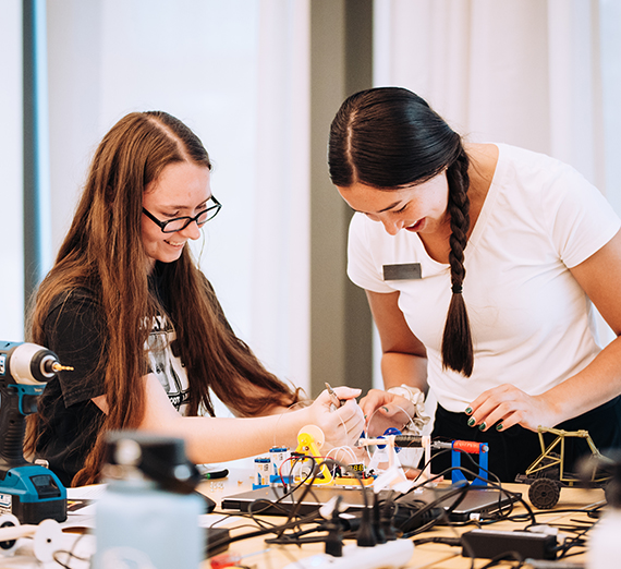 Two students collaborate on a project.