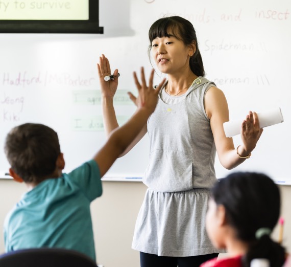 Students and teacher interacting 
