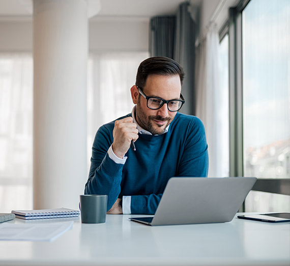 A businessman works on his computer