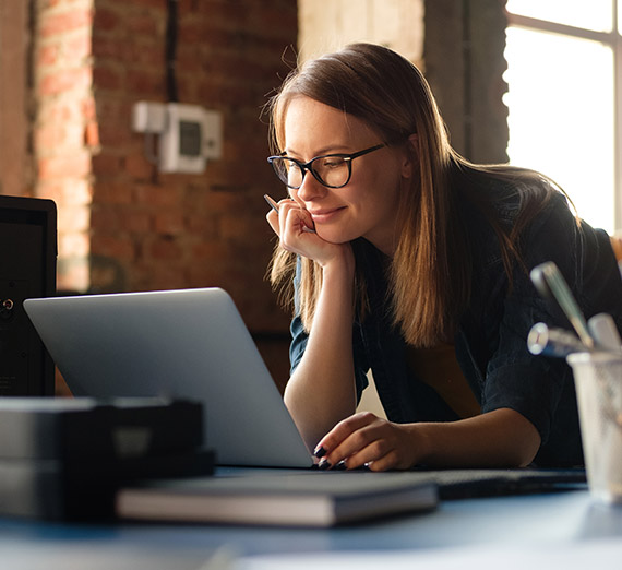 A woman working on a laptop