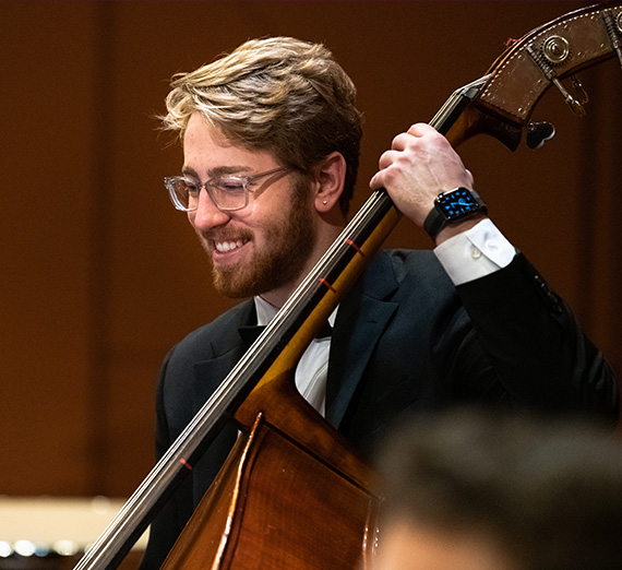 The bass player in the Gonzaga Symphony Orchestra.