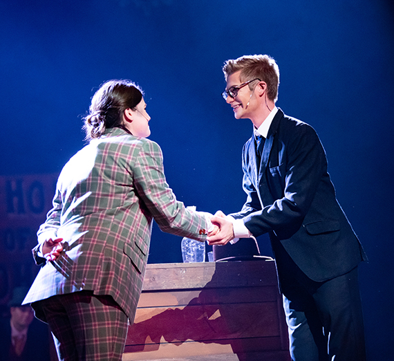 Two students act on stage