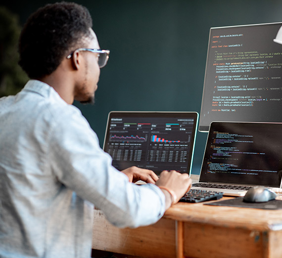 A man works on his computers.