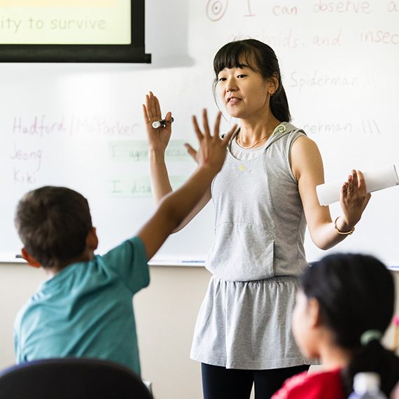An instructor works with students at Gonzaga's Summer Language Camp.