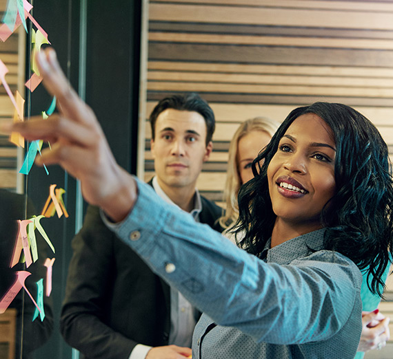 Coworkers brainstorm in a meeting.