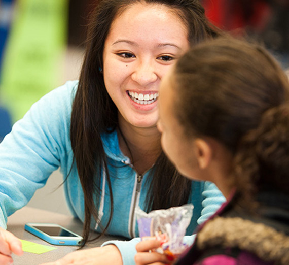 A Gonzaga student tutors a grade school student in math.