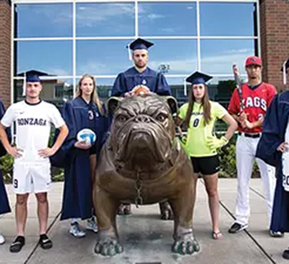Scholars standing with Spike the Bulldog.