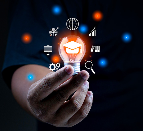 A hand holding a lighbulb with visual illustrations surrounding the bulb.