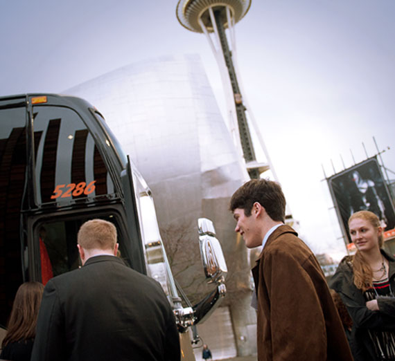 Gonzaga students board a bus during the Seattle "Trek" career development event 