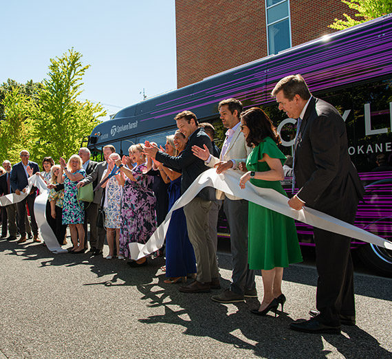 President McCulloh and other leaders at the ribbon-cutting ceremony for the new STA Cityline Electric bus service.