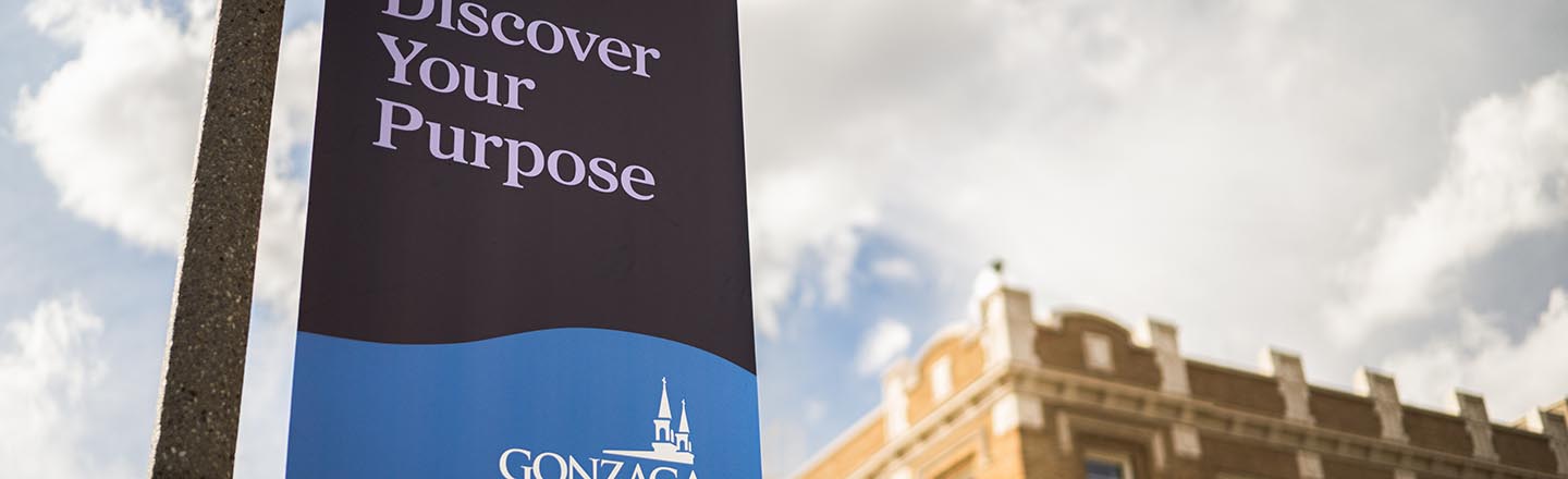 Campus sign with ������ Logo with text that reads Discover Your Purpose