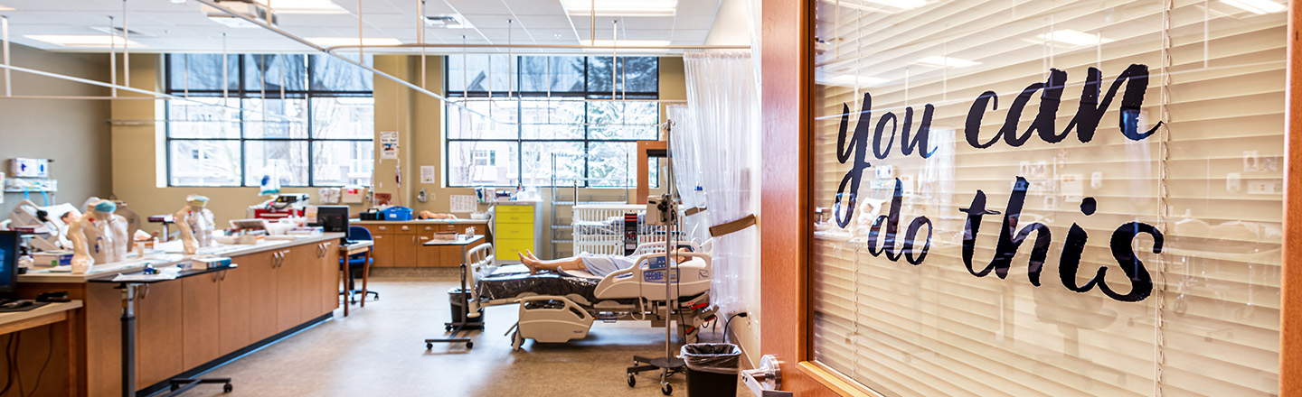 Open door to student medical training facility with "you can do this" written on the door.