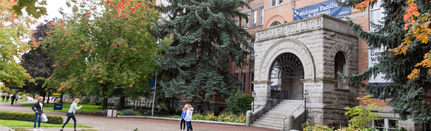 Students take pictures in front of College Hall