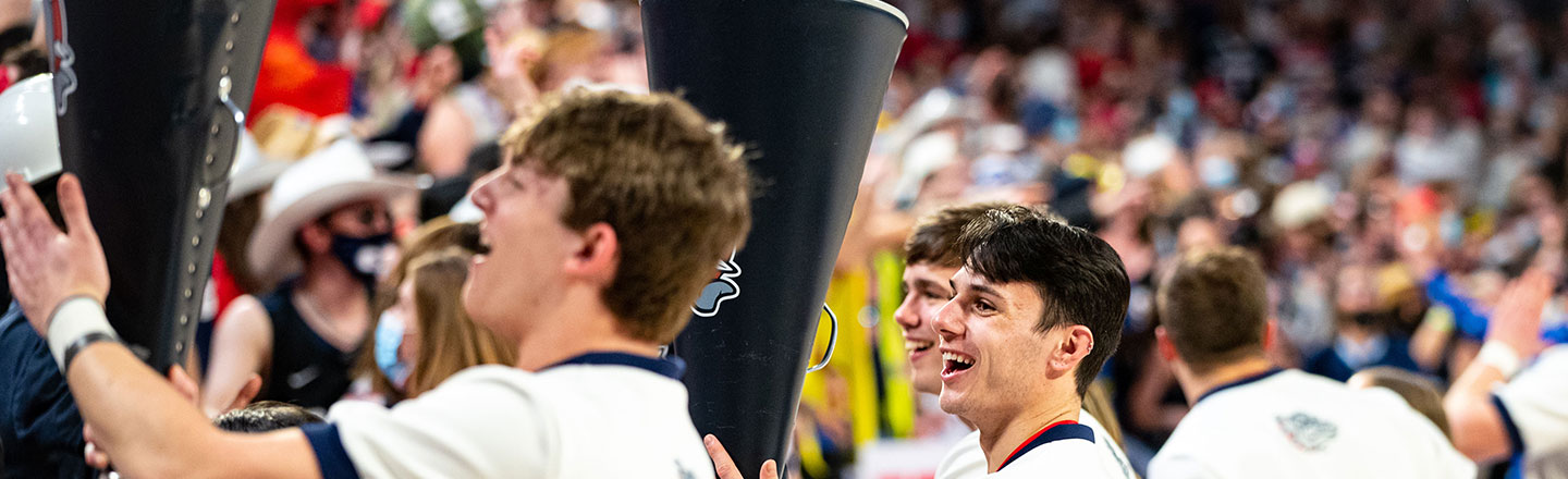 Cheerleaders rally the crowd at a Gonzaga basketball game.