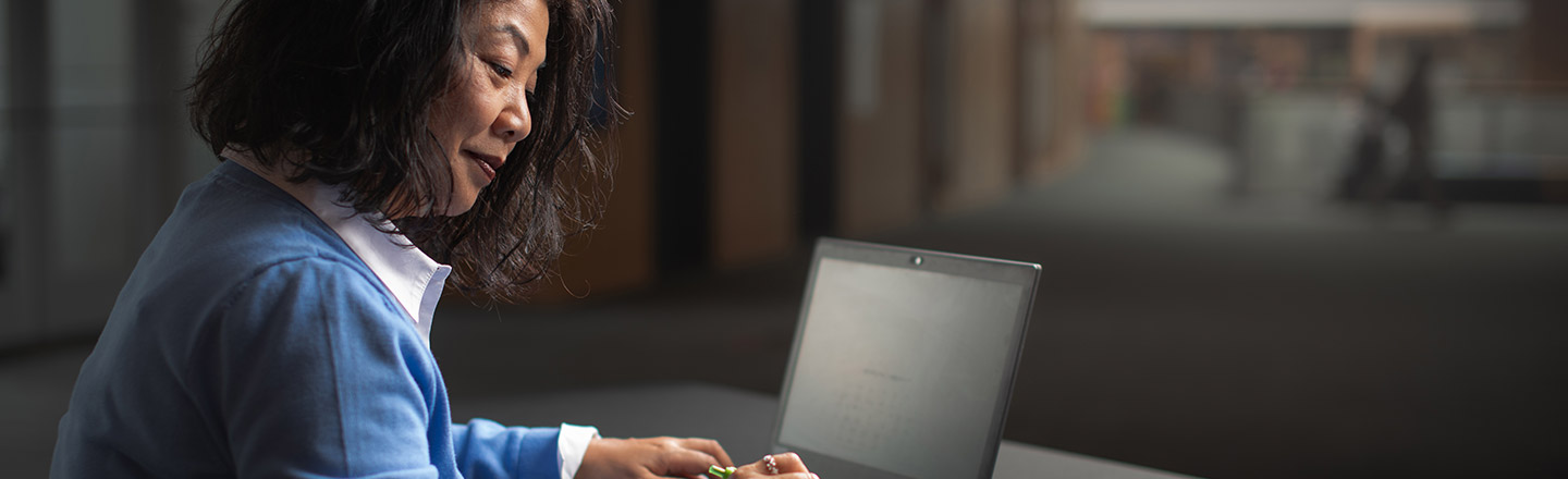 A women works on her laptop.