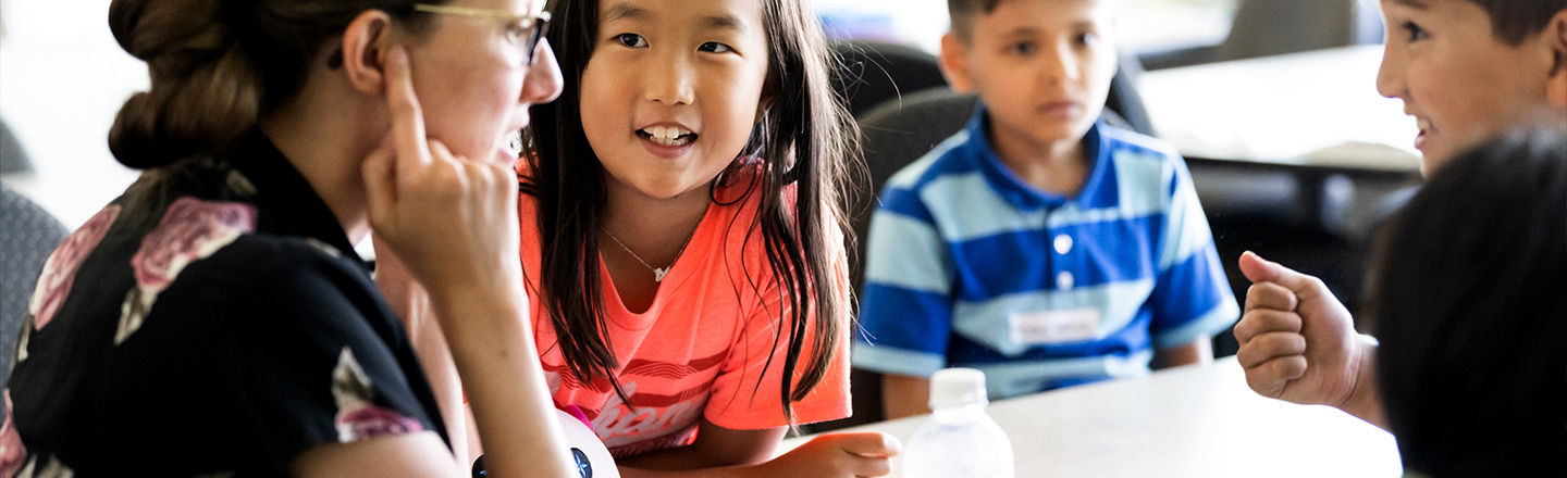 Instructors work with students at Gonzaga's Summer Language Camp.