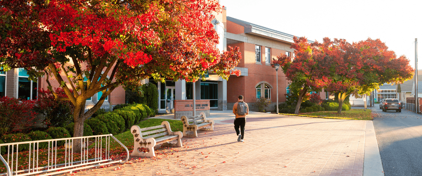 Student walking into Rosier Center