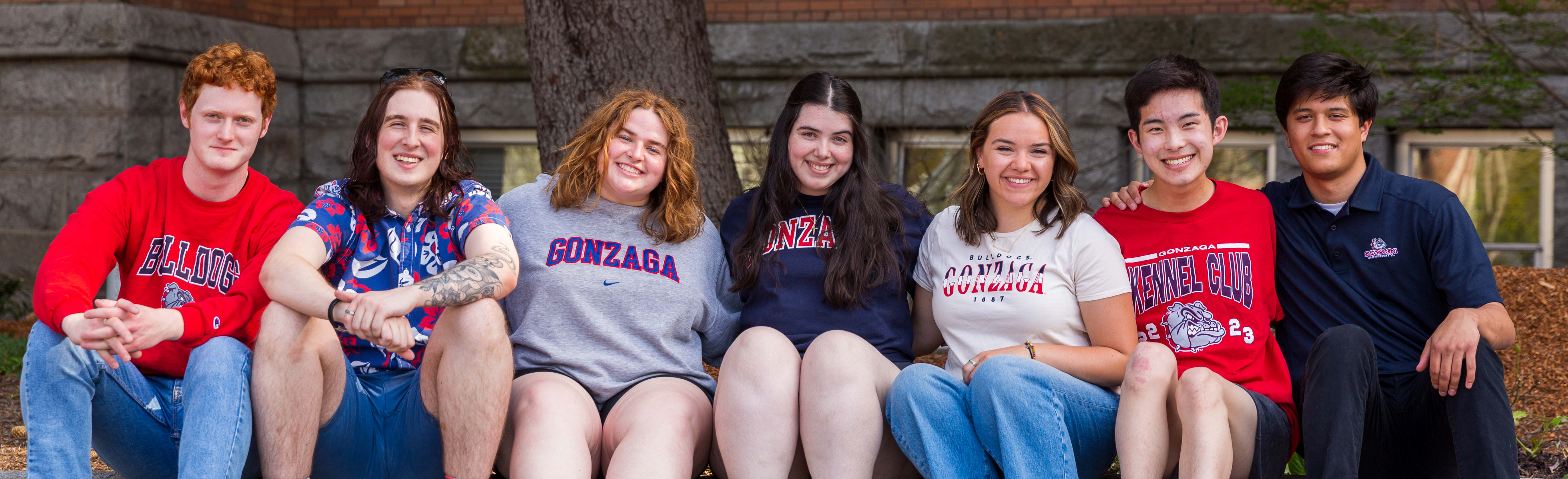 A group of students posing outside College Hall