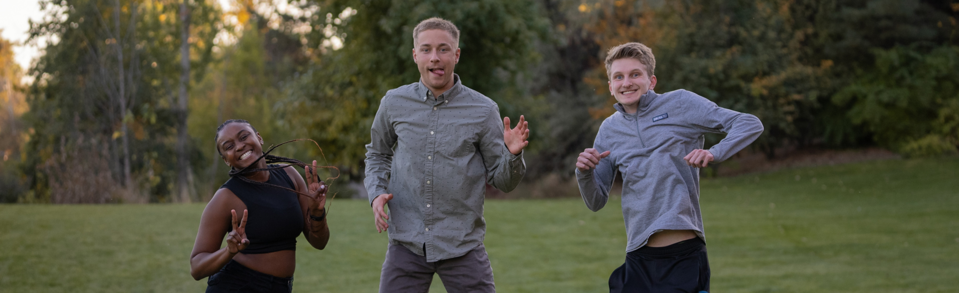 Students jumping in the air posing silly