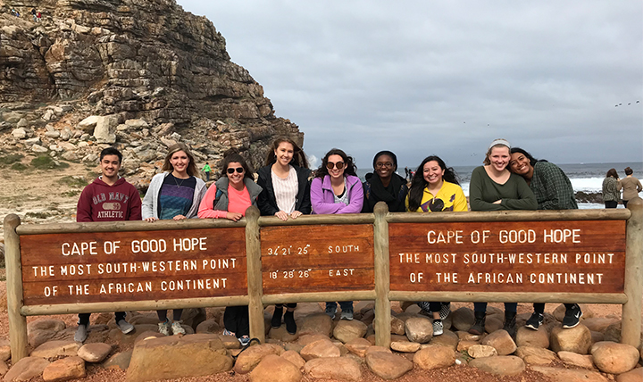 A group of students poses at the Cape of Good Hope, the southernmost point in Africa. 