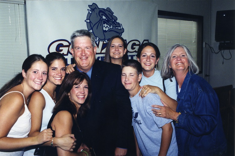 Steve Hertz smiles with a group of students.