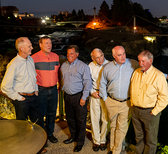 six male friends gather near Spokane River