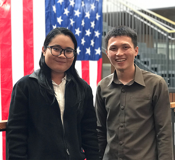 International fellows from Cambodia and Laos pose in front of US flag 