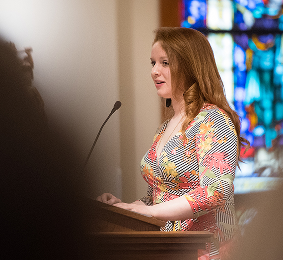 Liv Scheider at podium in student chapel