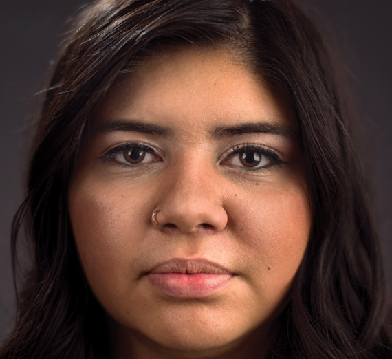 Profile of straightfaced college-aged Latina woman