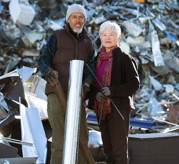 Action and Jackie Jackson pose with scrap metal at one of their recycling sites. 