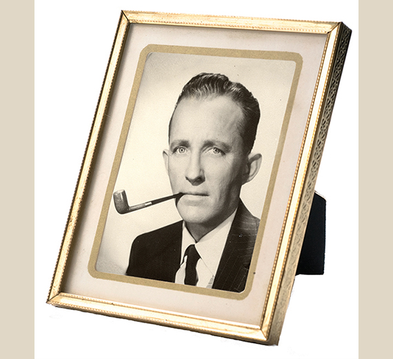 frame with photo of Bing Crosby with pipe