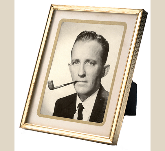 frame with photo of Bing Crosby with pipe 