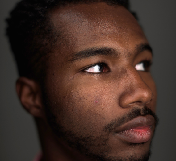 Side profile of straightfaced African-American man